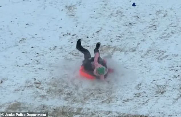 Viral Video Sparks Concern and Laughter as Jenks Officer's Sled Ride Turns Chaotic During Snowstorm