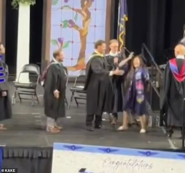 Wichita graduation disrupted as administrator forces students into unwanted handshakes.