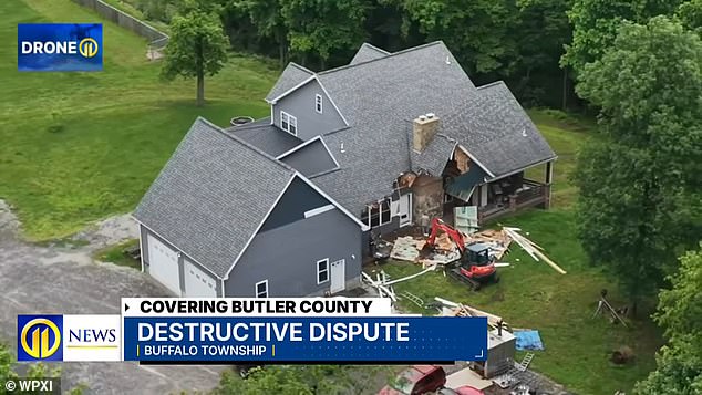 Pennsylvania man charged with destroying home with excavator while family trapped inside.